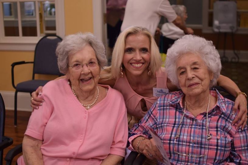 Tonia smiling with residents